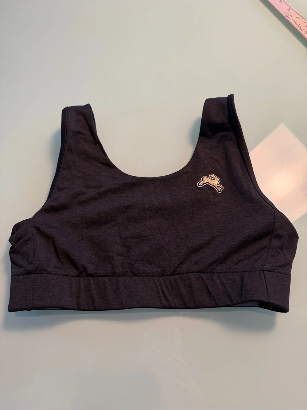 Tracksmith Black Scoop-Front Sports Bra with Gold Logo medium